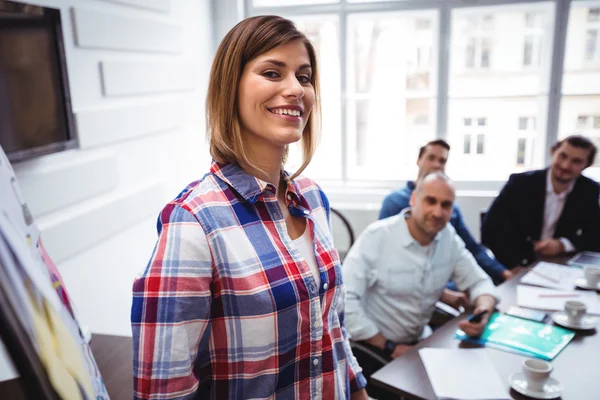 Cheerful businesswoman giving presentation — Stock Photo, Image