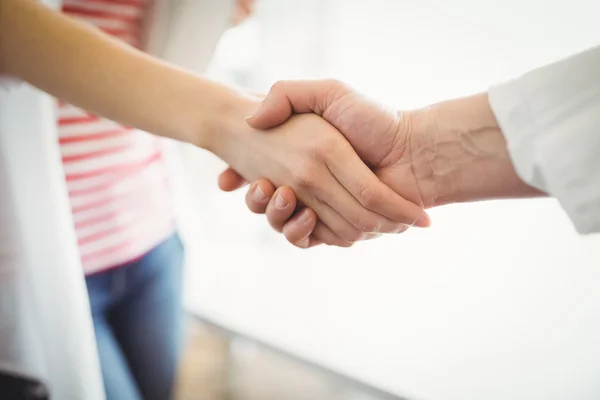 Creative business people shaking hands — Stock Photo, Image