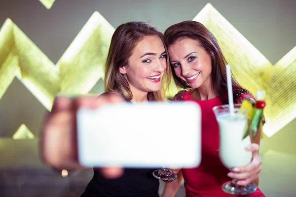 Happy women taking selfie in nightclub — Stock Photo, Image