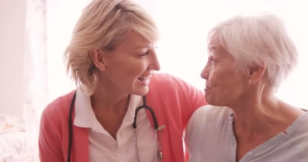 Doctor consoling to a senior woman — Stock Video