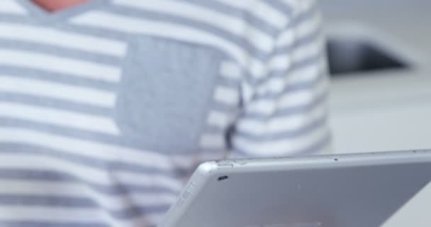 Man drinking an espresso and using tablet — Stock Video