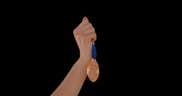 Hands throwing a medal — Stock Video