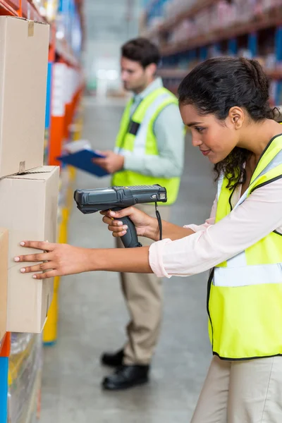 Focus of serious worker is working on cardboard boxes — Stock Photo, Image