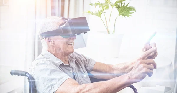 Man in wheelchair using virtual reality device — Stock Photo, Image