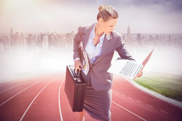 Businesswoman looking at laptop — Stock Photo, Image