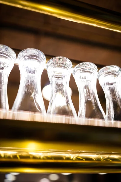 Glasses arranged on the bar shelf — Stock Photo, Image