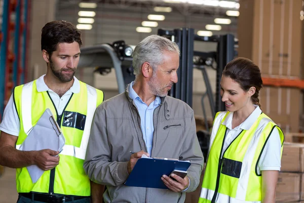 Portrait of manager is talking with workers — Stock Photo, Image