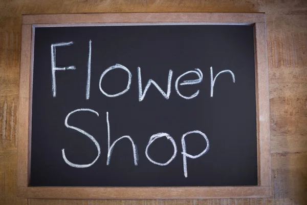 Közeli kép a pala virág bolt jel — Stock Fotó