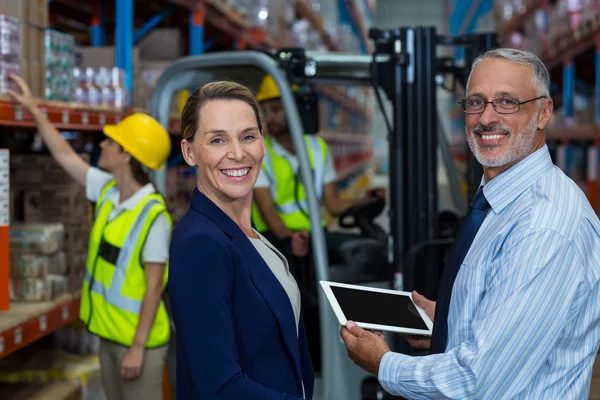 Business people are holding tablet — Stock Photo, Image