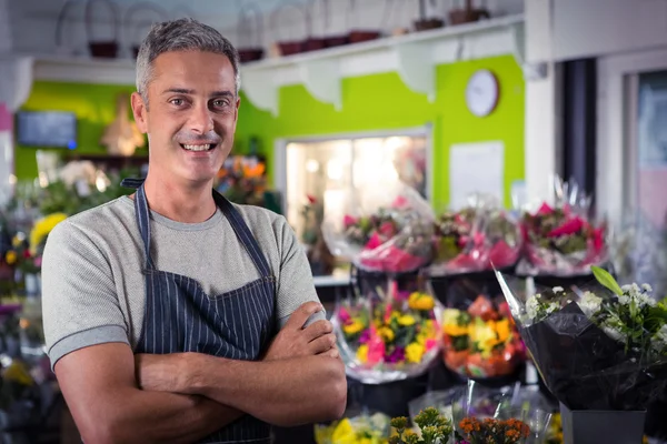 Male florist standing with arms crossed — Stock Photo, Image