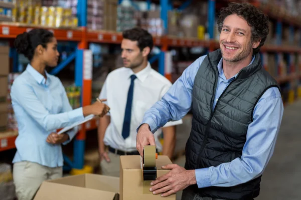 Focus of manager is smiling and posing during work — Stock Photo, Image