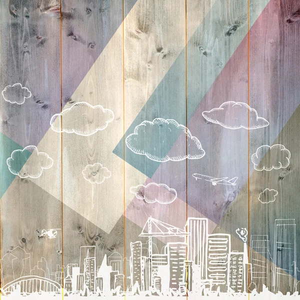 Cityscape doodle against colored wood — Stock Photo, Image