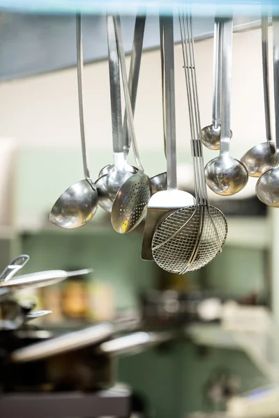 Close-up of hanging kitchen utensils — Stock Photo, Image