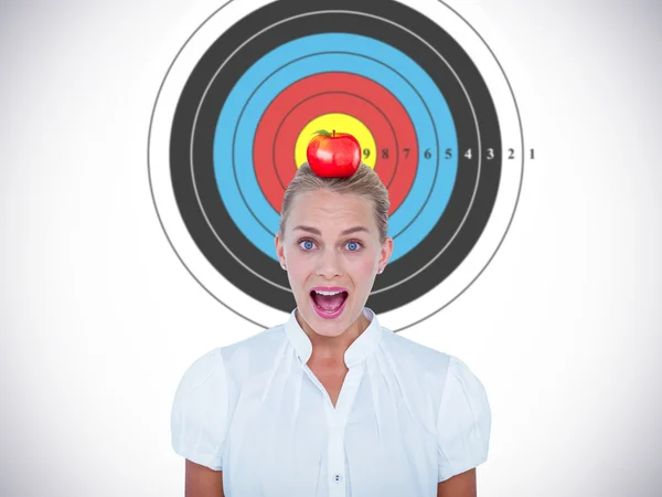 Businesswoman in shock against red apple — Stock Photo, Image