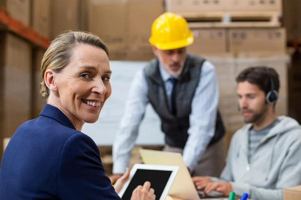 Smiling workers looking at camera — Stock Photo, Image