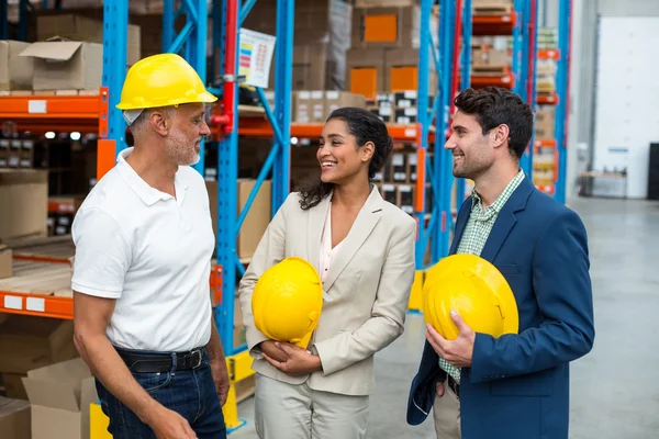 Portrait of managers with hard hat are looking each other — Stock Photo, Image