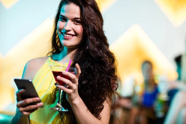 Woman having red martini — Stock Photo, Image