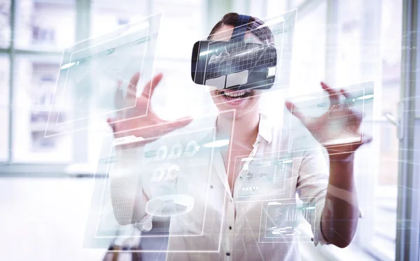 Businesswoman holding virtual glasses — Stock Photo, Image