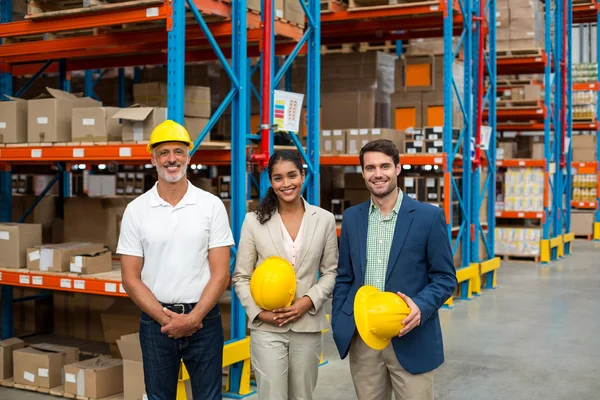 Portrait of managers are holding hard hat and posing — Stock Photo, Image