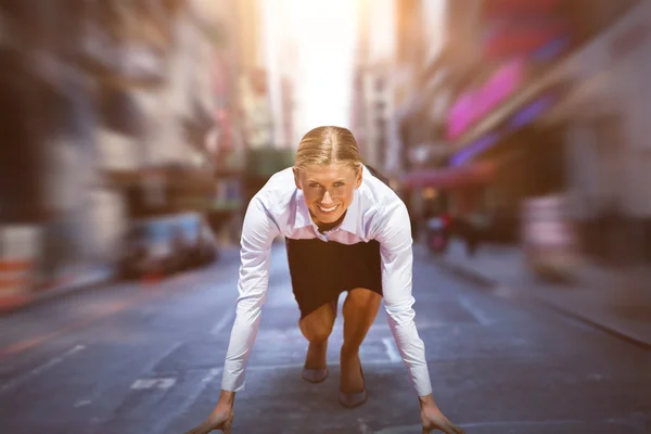 Businesswoman in starting blocks — Stock Photo, Image