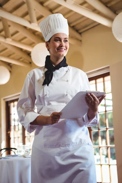 Chef holding a clipboard — Stock Photo, Image
