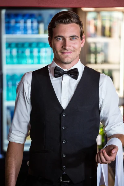 Bartender with napkin draped on his hand — Stock Photo, Image