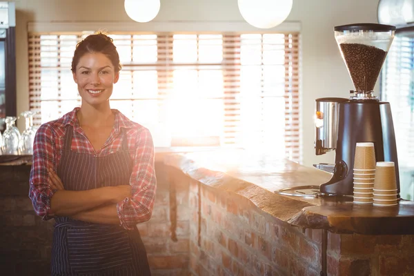 Waitress standing with arms crossed — Stock Photo, Image