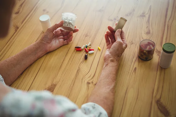 Woman with medics on both hands — Stock Photo, Image