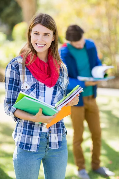 Portrait of college girl holding notes — Stock Photo, Image