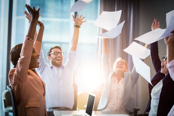 Business people throwing papers in the air — Stock Photo, Image