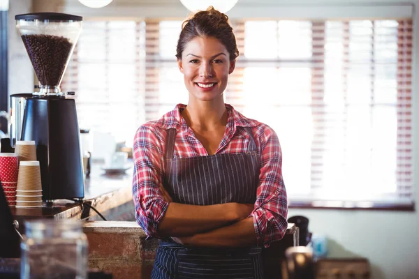 Waitress standing with arms crossed — Stock Photo, Image