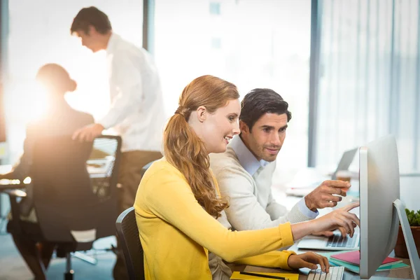 Executives working on laptop and computer — Stock Photo, Image