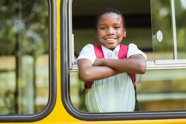 Portrait of schoolboy looking from school bus — Stock Photo, Image