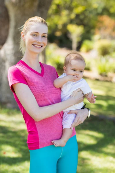 Woman holding her baby — Stock Photo, Image