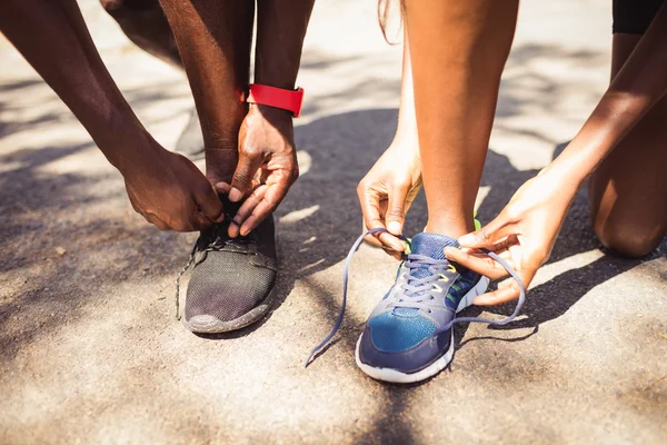 Focus on family doing laces — Stock Photo, Image