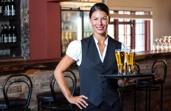 Portrait of waitress holding serving tray — Stock Photo, Image