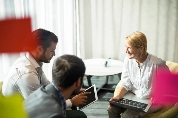 Business people interacting using digital tablet and laptop — Stock Photo, Image