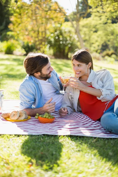 Couple toasting glasses of wine while having breakfast — Stock Photo, Image