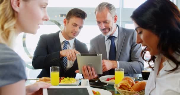 Businessmen and women using tablet — Stock Video