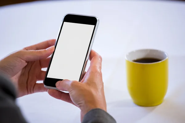 Woman taking a picture of coffee — Stock Photo, Image