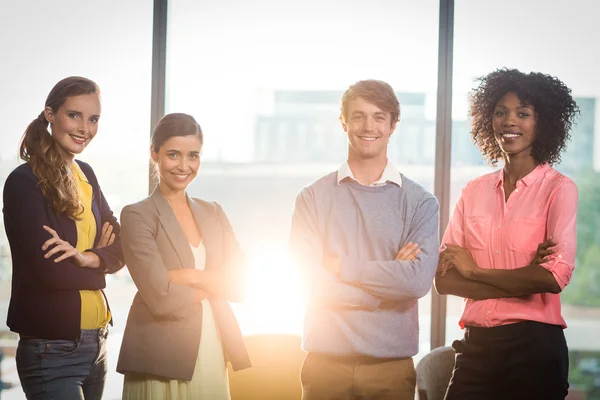 Portrait of business people standing with arms crossed — Stock Photo, Image