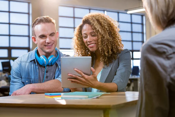 Colleagues looking in tablet computer — Stock Photo, Image