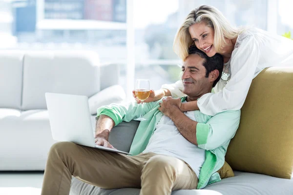 Woman and man using at home — Stock Photo, Image