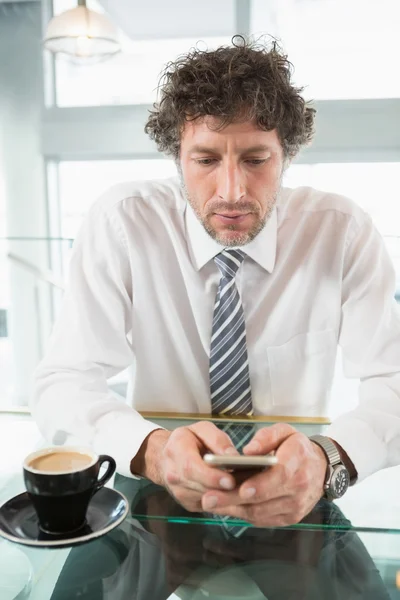 Businessman text messaging on mobile phone — Stock Photo, Image