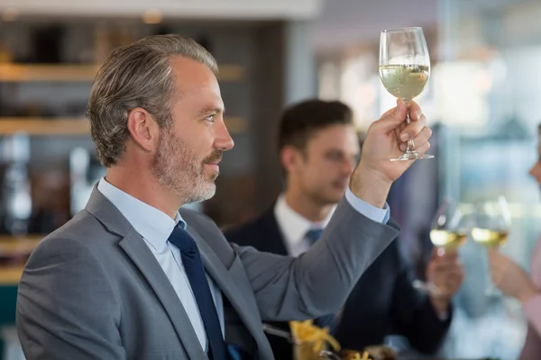 Portrait of businessman toasting his beer glass — Stock Photo, Image