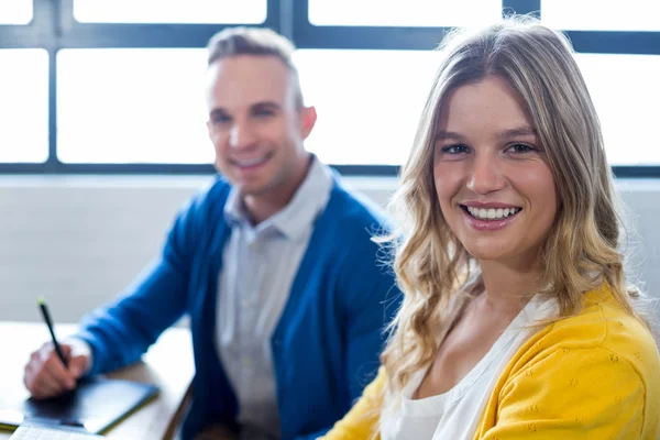 Man and woman in creative office — Stock Photo, Image