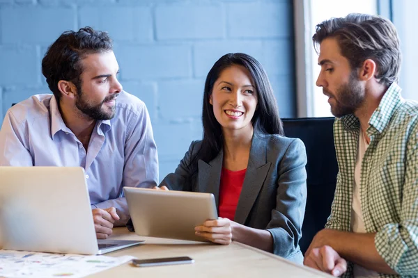 Creative colleagues using digital tablet — Stock Photo, Image