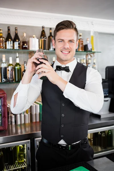 Waiter shaking cocktail — Stock Photo, Image