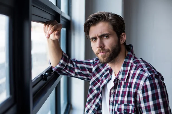 Businessman standing in creative office — Stock Photo, Image