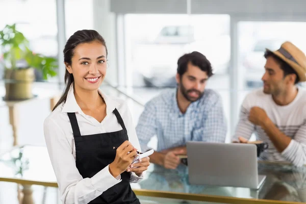 Portrait of waitress taking an order in cafe — Stock Photo, Image